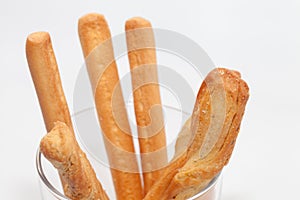 Bread stick on cup isolated on white