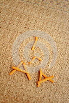 Bread sticks on background of brown wood.