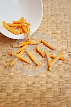 Bread sticks on background of brown wood.