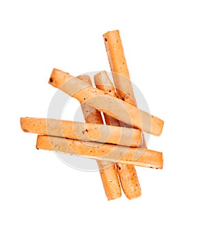 Bread sticks isolated on white background. Grissini, Italian breadsticks with onions and herbs. Top view.