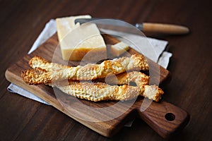 Bread sticks, twisted grissini puff pastry with parmesan cheese photo