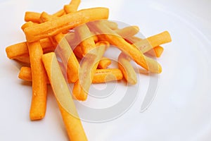 Bread sticks in white plate on a table