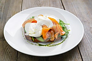 Bread toast and poached egg with smoked salmon