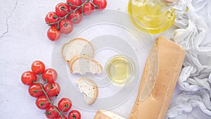 bread , tomato and olive oil on table