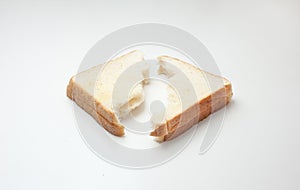 Bread torned in half on white background.