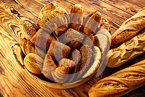 Bread varied mix on golden aged wood table