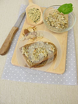 Bread with vegan spread from peeled hemp seeds, nuts and herbs