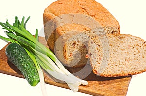 Bread and vegetables on a white background