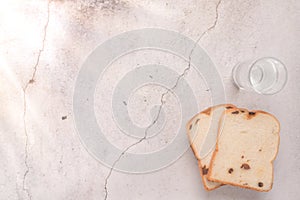 Bread and water with sunray on left side food and drink concept with copy space