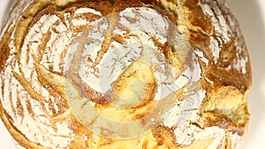 Bread  white, cut piece, rotation, turning counterclockwise, on white background, top macro view.