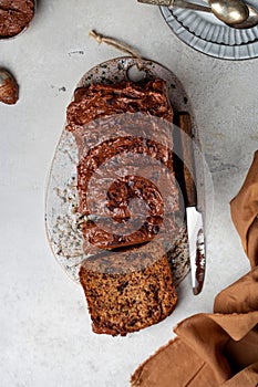 bread with zucchini, bananas and chocolate on a light background