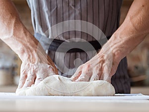 Breadbaking food cooking man hands knead dough photo