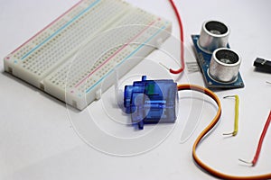 Breadboard with micro servo and ultrasonic sensor module for development board projects