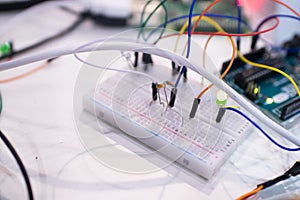 Breadboard and microcontroller with circuit and light sensor. ST