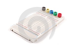 Empty breadboard for electronics prototyping on the whi