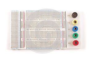 Empty breadboard for electronics prototyping on the whi