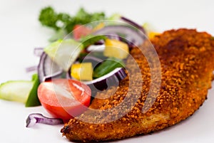 Breaded chicken breast with vegetables