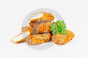 Breaded Chicken Inner Fillet on a White Background,Chicken Breaded Raw Meat.Chicken Breaded Fillet. Breaded chicken