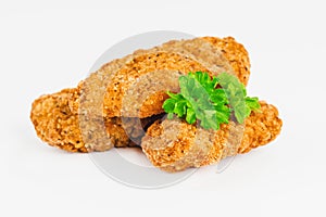 Breaded Chicken Inner Fillet on a White Background,Chicken Breaded Raw Meat.Chicken Breaded Fillet. Breaded chicken