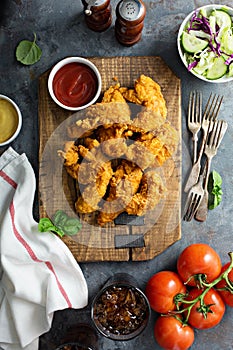 Breaded chicken tenders with ketchup