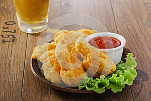 Breaded chicken wings with ketchup