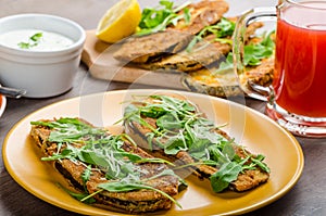 Breaded eggplant parmesan and arugula