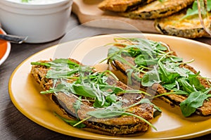 Breaded eggplant parmesan and arugula