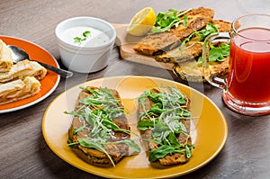 Breaded eggplant parmesan and arugula