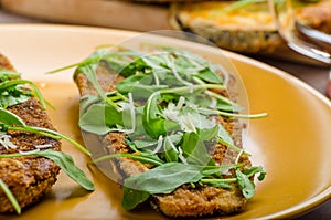 Breaded eggplant parmesan and arugula