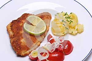 Breaded fish with potato salad