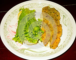 Breaded flying fish fried in hot coconut oil and served on a fresh roll