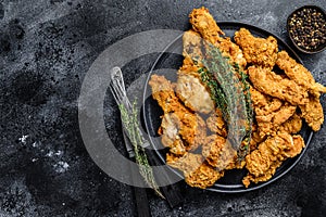 Breaded Fried Crispy Various Chicken. Black background. Top view. Copy space