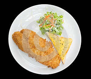 Breaded fried fish with bread and Vegetable isolated on the black background with clipping path,top view