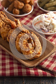 Breaded and Fried Jumbo Shrimp with Tails on a Wooden Table