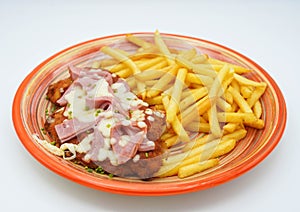 Breaded milanese with ham and cheese South American style with French fries