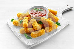 Breaded mozzarella cheese sticks with tomato basil sauce