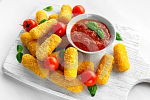 Breaded mozzarella cheese sticks with tomato basil sauce