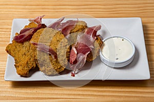 Breaded parasol mushrooms with ham