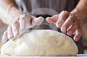 Breadmaking food culinary man hands knead dough