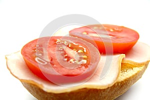 Breadroll with ham and tomato