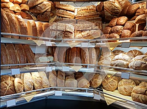 Breads and bagels on bakery front store in greece