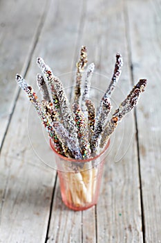 Breadstick grissini with chocolate sprinkles and toppings, snack