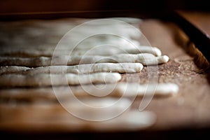 Breadsticks on baking tray in oven