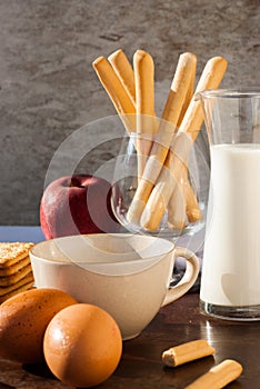 Breadsticks ,Banana cake, milk and Biscuits with black coffee i