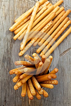 Breadsticks grissini on wooden background