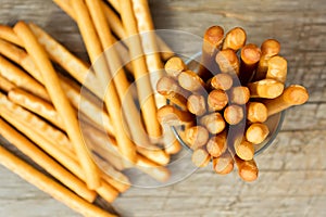 Breadsticks grissini on wooden background