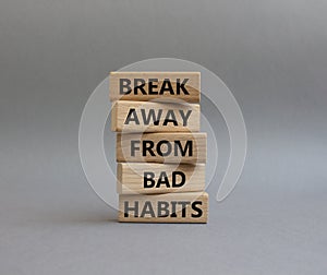 Break away from bad habits symbol. Wooden blocks with words Break away from bad habits. Beautiful grey background. Business and