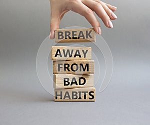 Break away from bad habits symbol. Wooden blocks with words Break away from bad habits. Beautiful grey background. Businessman