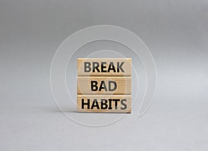 Break bad habits symbol. Concept words Break bad habits on wooden blocks. Beautiful grey background. Medicine and Break bad habits