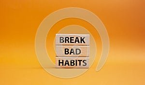 Break bad habits symbol. Concept words Break bad habits on wooden blocks. Beautiful orange background. Medicine and Break bad